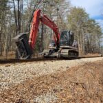 High-rail mowing for vegetation management
